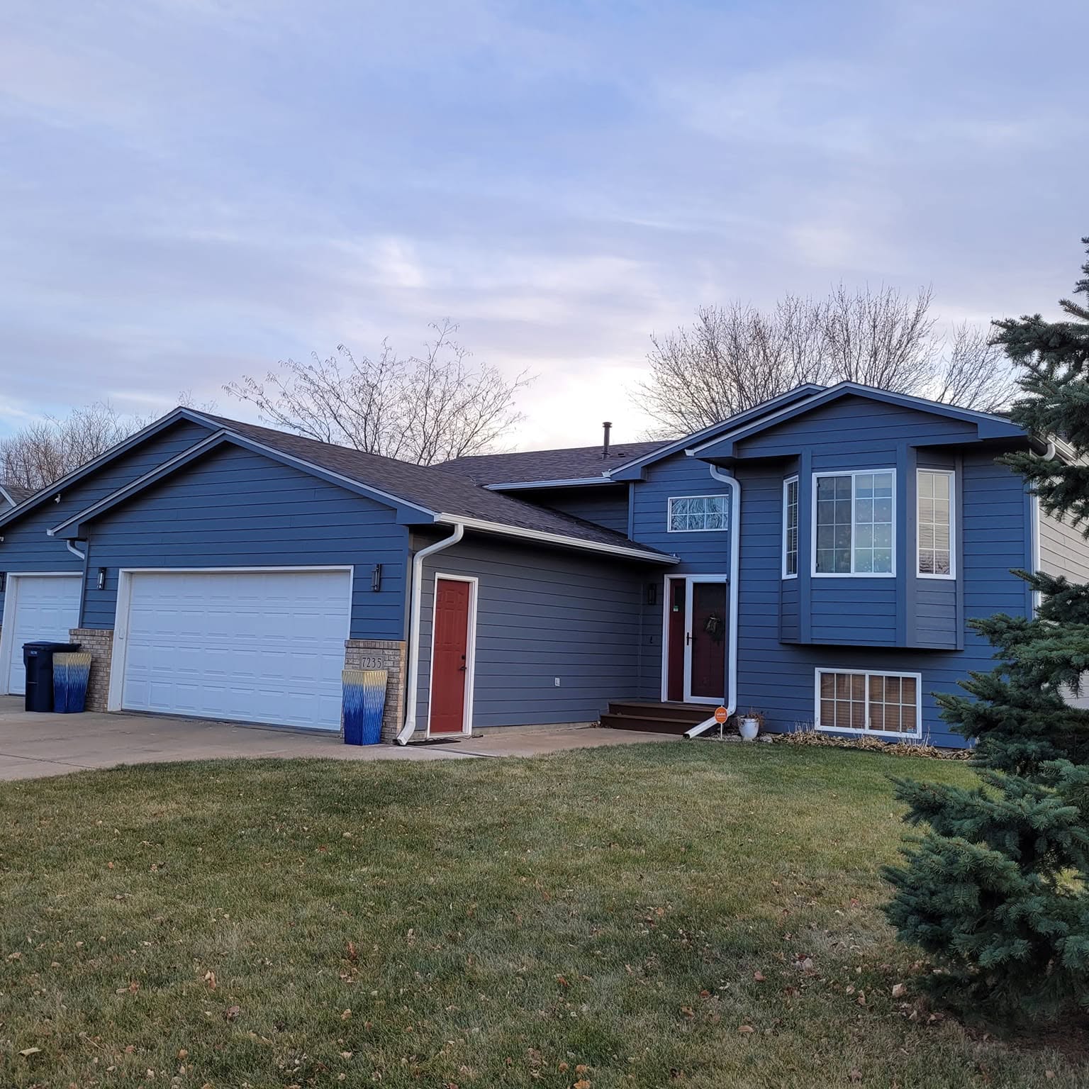 New roof and exterior on a two-story home by Clark Roofing